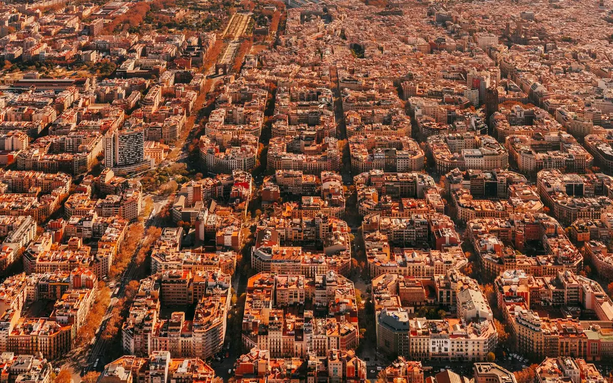 The rooftops and blocks of Barcelona seen from a helicopter
